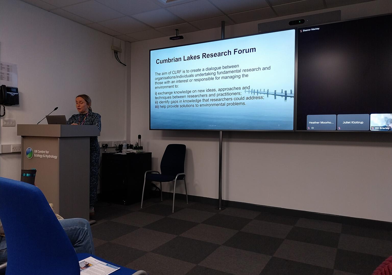 Heather Moorhouse at the lectern introducing the Cumbrian Lakes Research Forum 2024