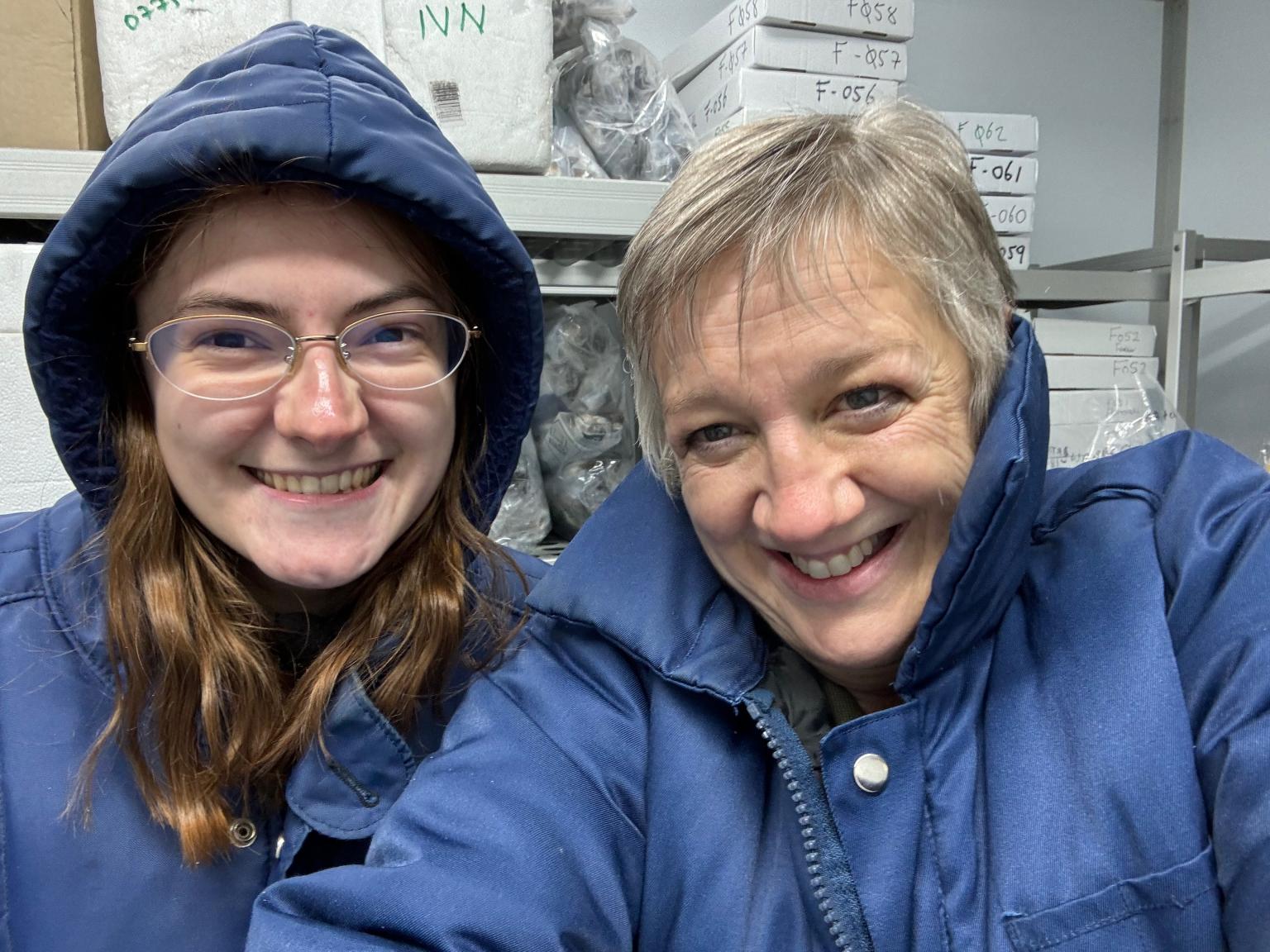 Two people with insulated coats on