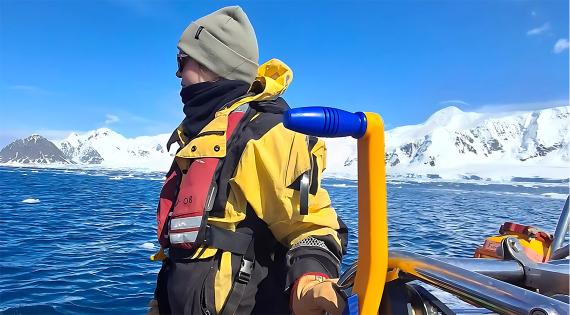 Alanna Grant on a boat in the sea off Antarctica