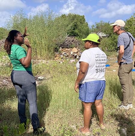 Zoya Buckmire (left) from Anguilla Department of Natural Resources speaks to workshop participants on a field excursion