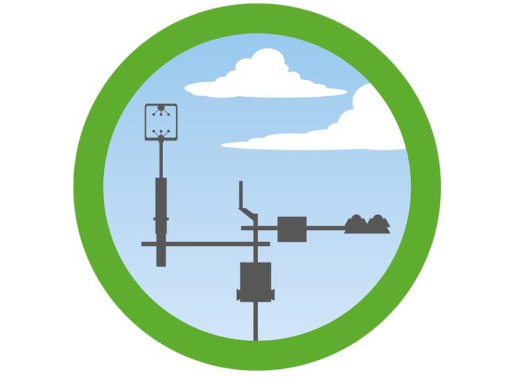 Green circle with flux tower and skyline