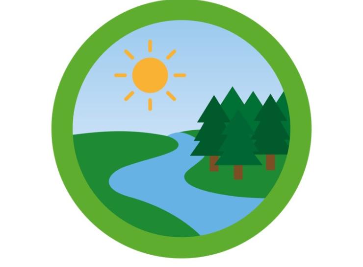 Green circle with river running through grass and trees, with blue sky and sun