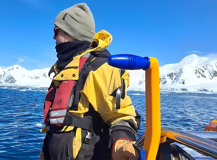 Alanna Grant on a boat in the sea off Antarctica